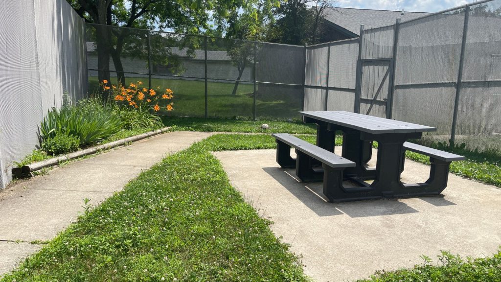 Picnic table in an enclosed outdoor area