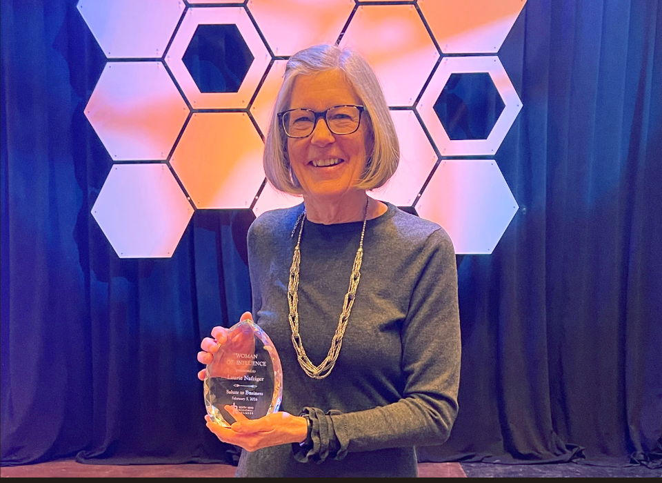 Laurie Nafziger with her 2026 Woman of Influence Award