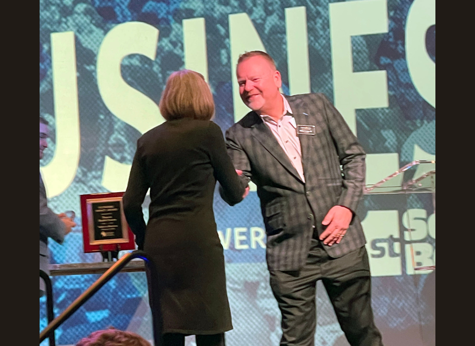 Laurie Nafziger is presented her award by sponsor Gurley Leep
